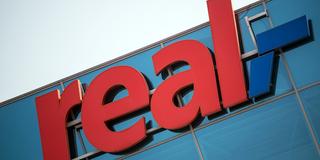Logo: Real-Supermarkt (Foto: dpa)