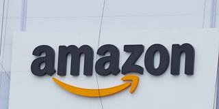 Schriftzug des Online-Unternehmen Amazon (Foto: picture alliance/Georg Wendt/dpa)